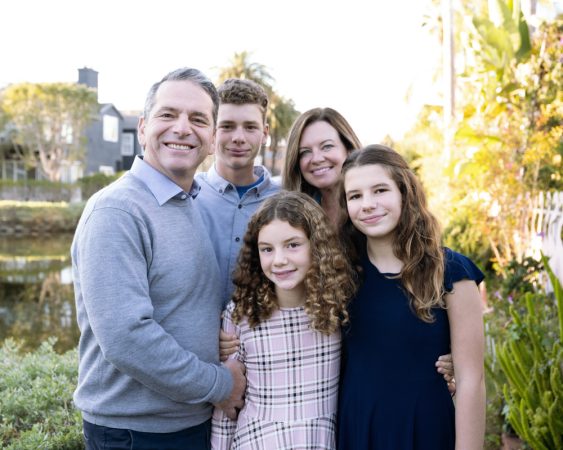 Portrait of the G family at the Venice Canals in Los Angeles, California, at sunset.